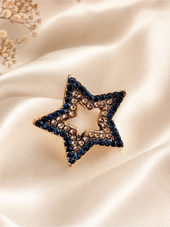 Anthropologie Jewelry - Gold Star Brooch with Blue and Champagne Crystals